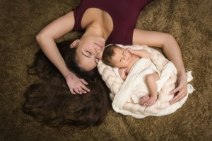 Long hair mother with baby