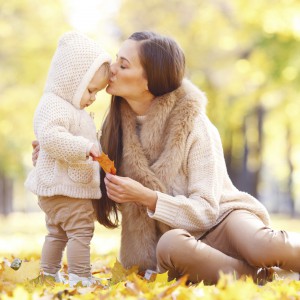 Mother and child in autumn park
